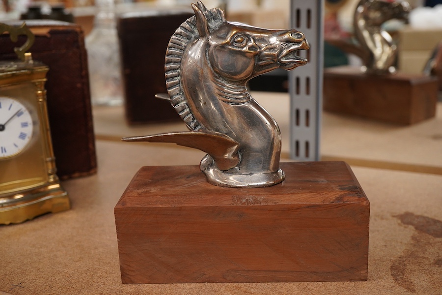 A silver plated Pegasus horse's head car mascot, signed D.G. Yeo, dated 1924, mounted on a wooden plinth